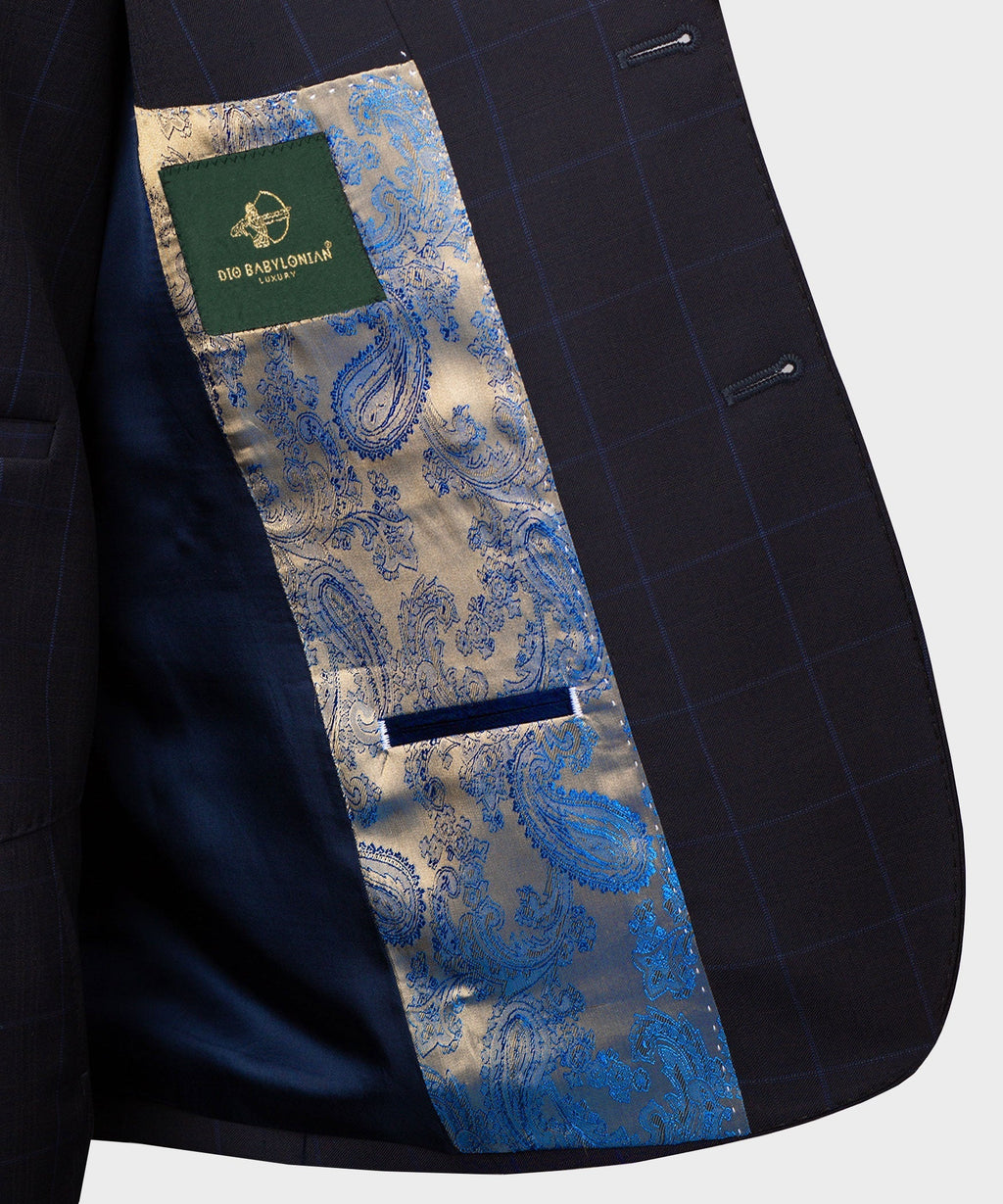 Inside lining detail of dark suit jacket with blue paisley panel and label