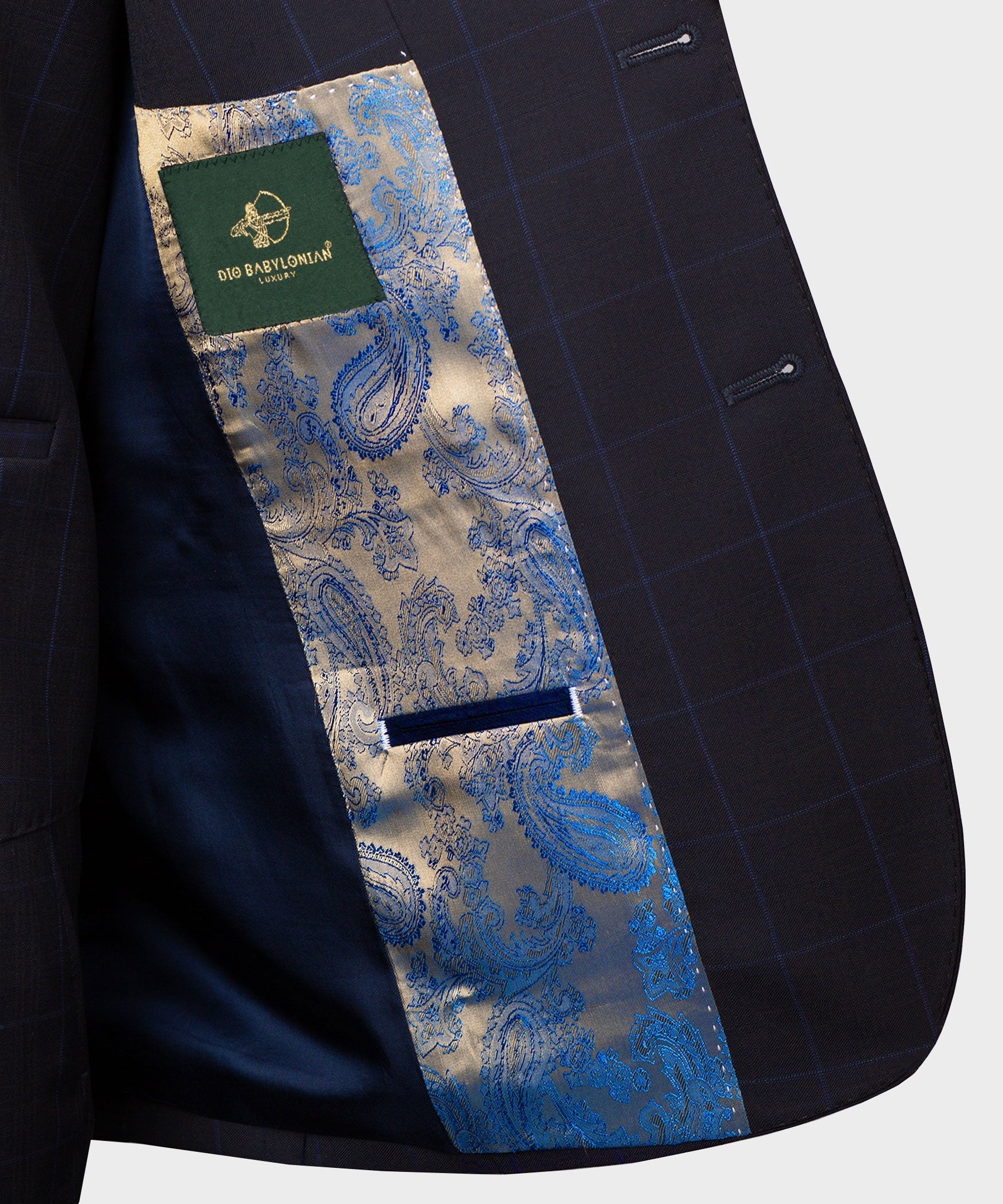 Inside lining detail of dark suit jacket with blue paisley panel and label