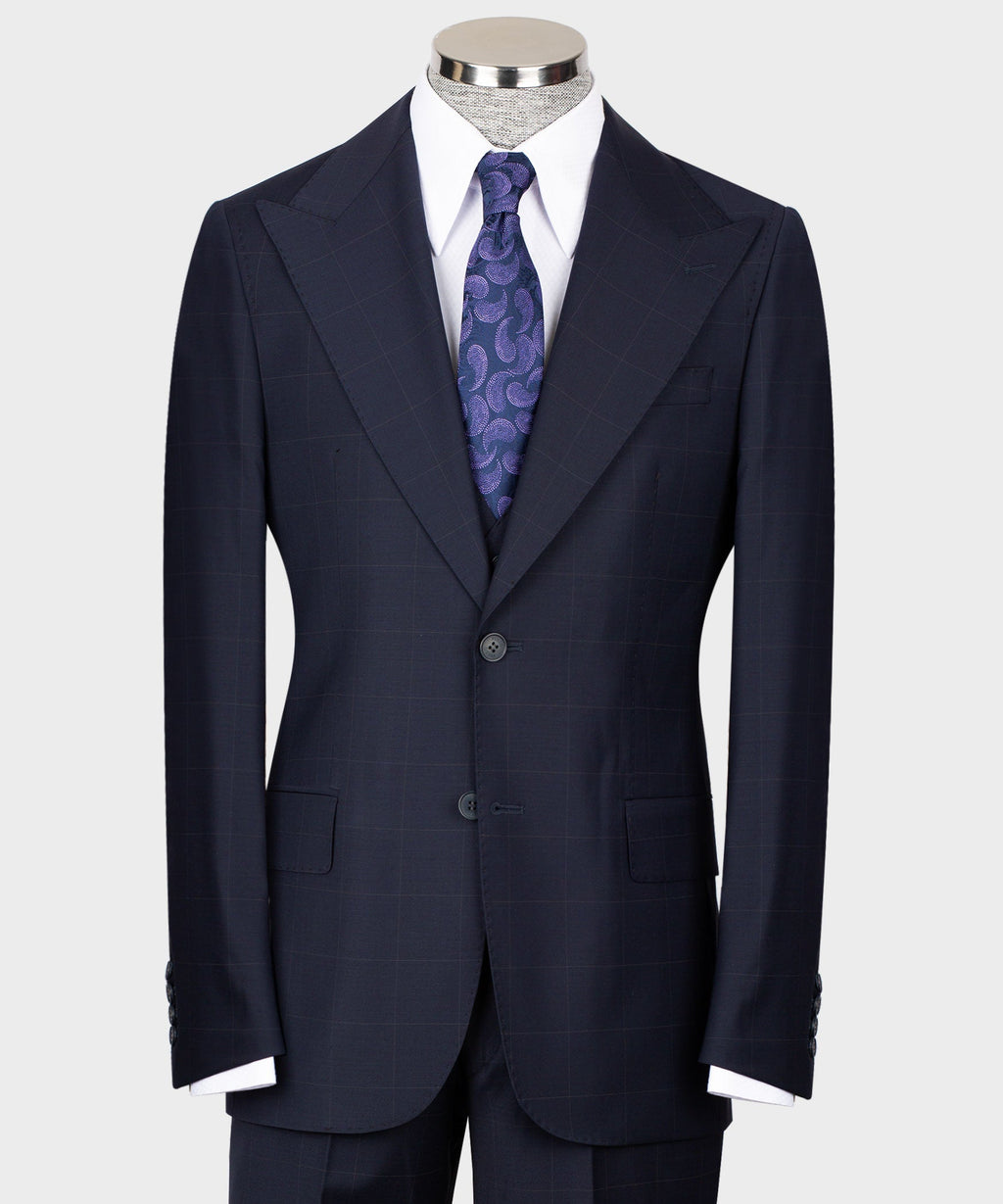 Navy tailored three-piece suit: jacket, vest, white shirt, purple patterned tie