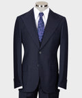 Navy tailored three-piece suit: jacket, vest, white shirt, purple patterned tie