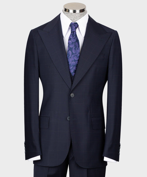 Navy tailored three-piece suit: jacket, vest, white shirt, purple patterned tie