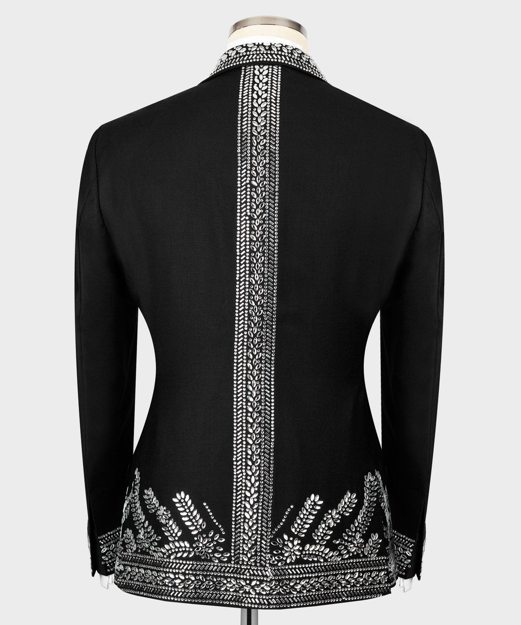 Back view of black tuxedo jacket with vertical silver embroidery panel and hem detailing