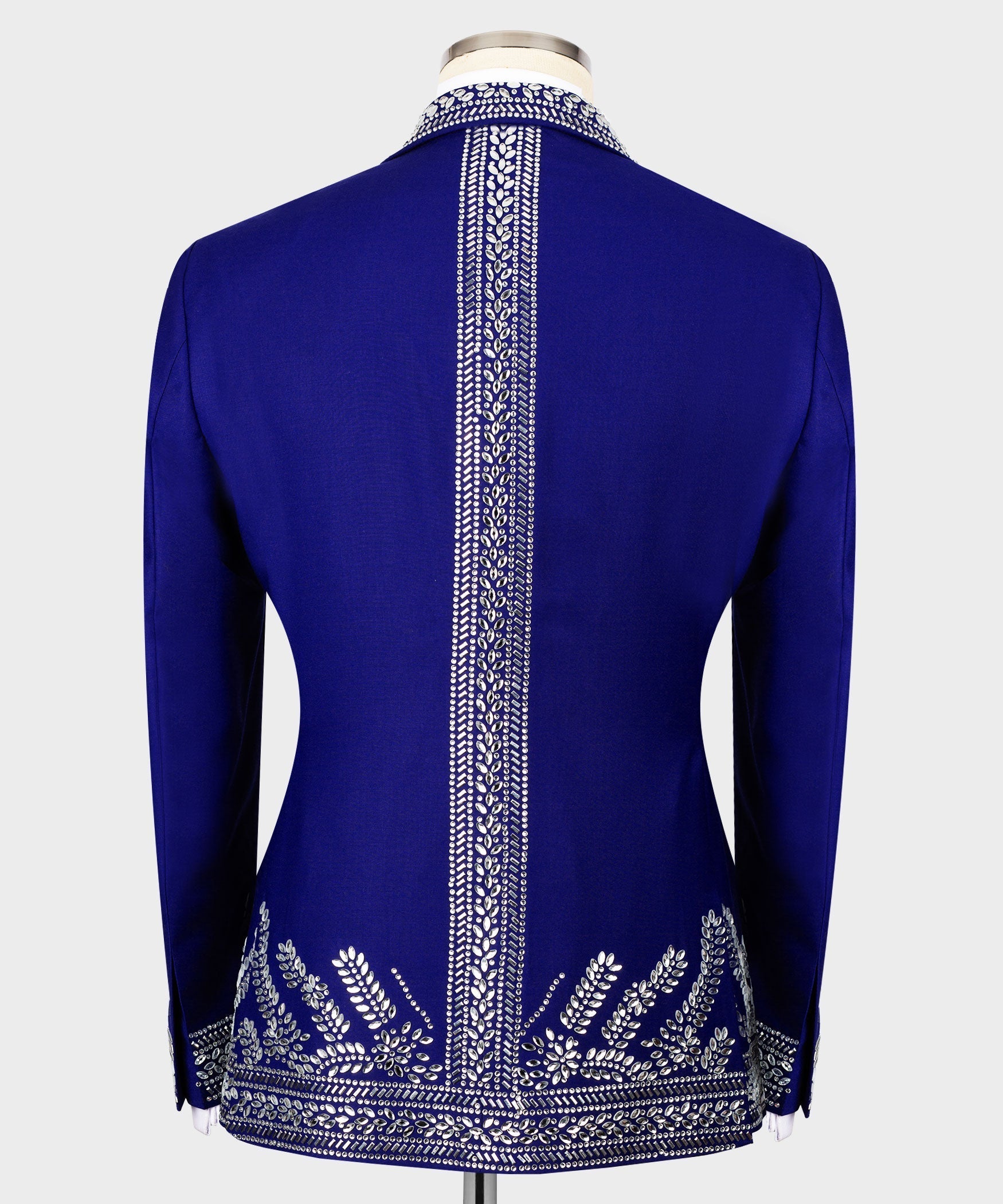 Back view of blue tuxedo jacket with vertical silver embroidery at center back