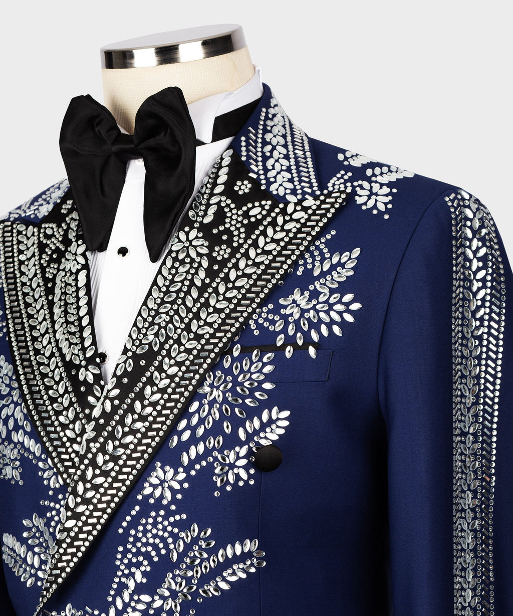 Close-up of dark blue tuxedo jacket with silver stone embroidery, black satin lapel, two-button front