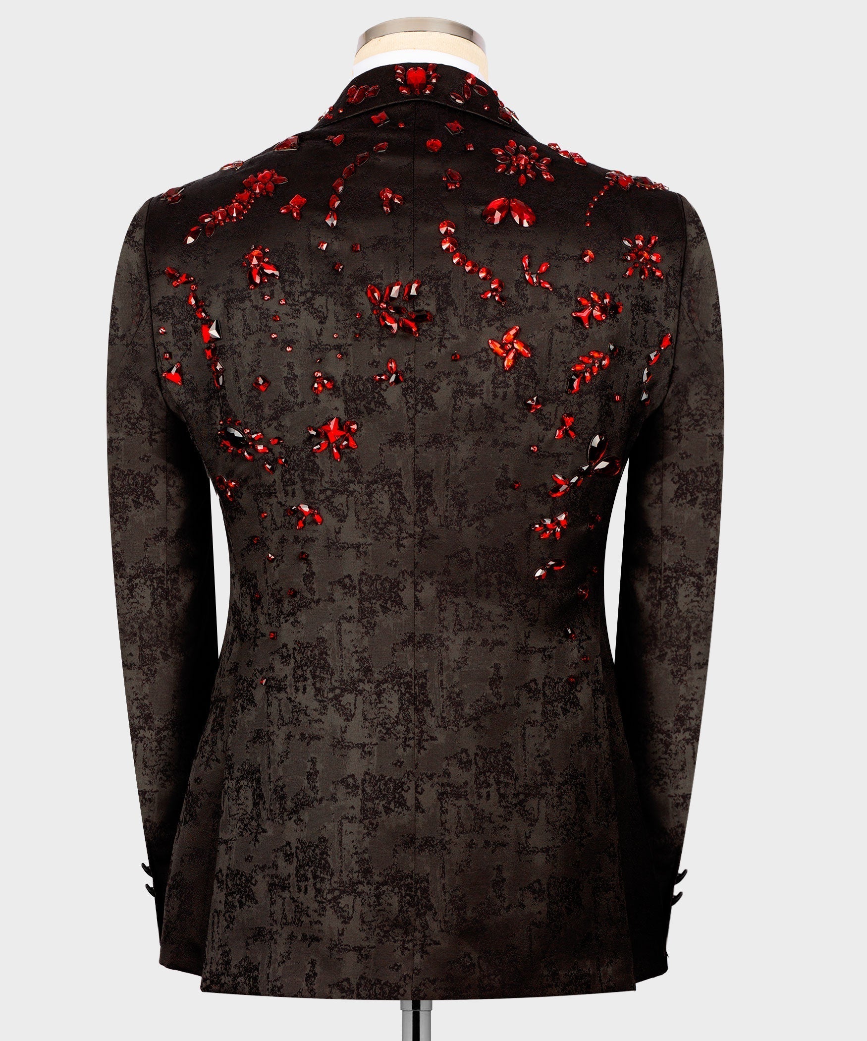 Black tuxedo jacket back view with scattered red stone embroidery across the shoulders