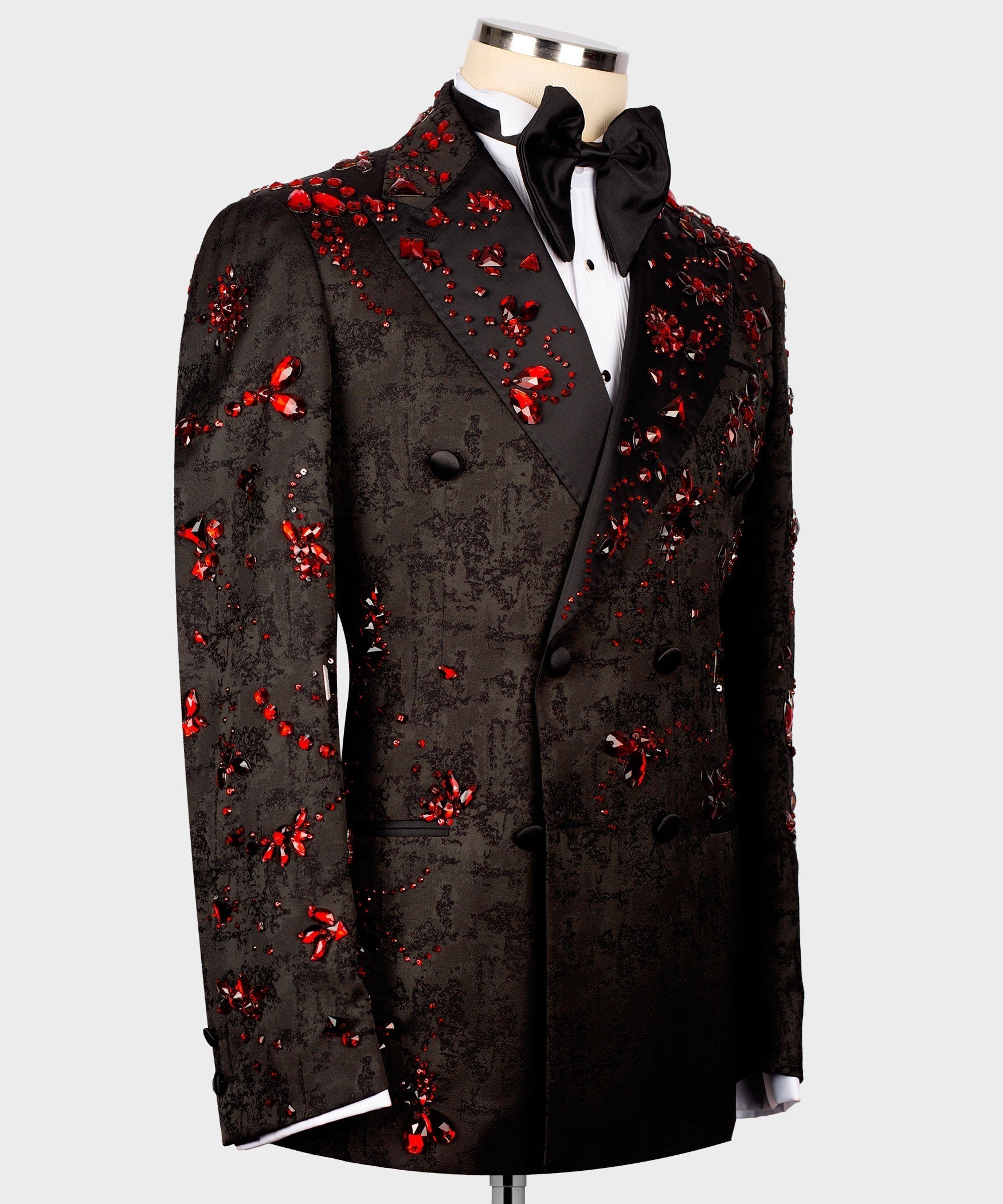 Black tuxedo jacket with red stone embellishments and black satin bow tie