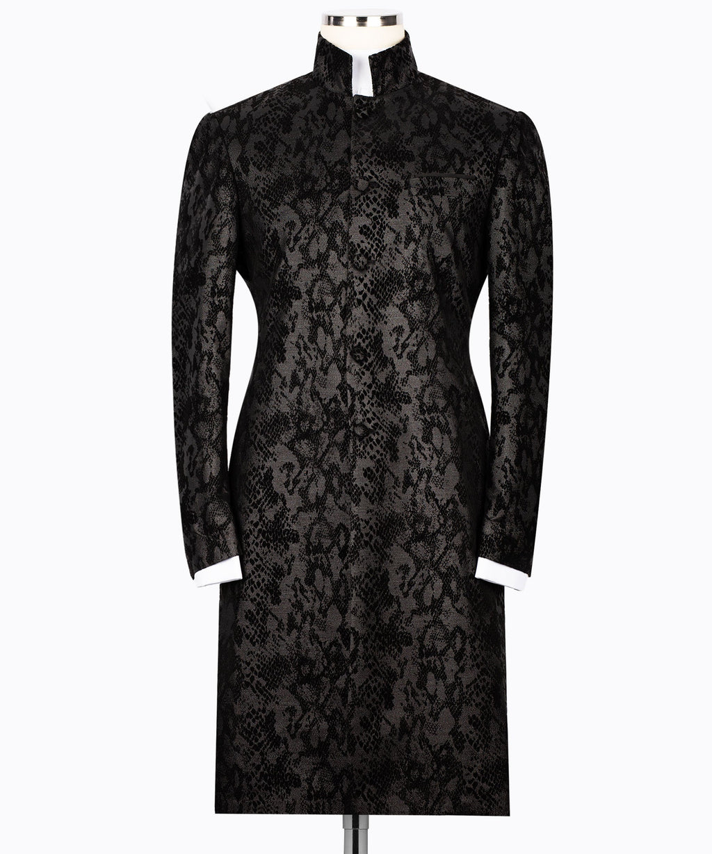 Black snake-print tuxedo jacket with long waist belt and high neckline, long sleeves