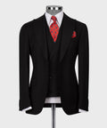 Black 3-piece vest suit: blazer, waistcoat, red patterned tie.