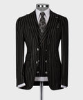 Black pinstriped suit jacket, double-breasted with white dress shirt and patterned tie