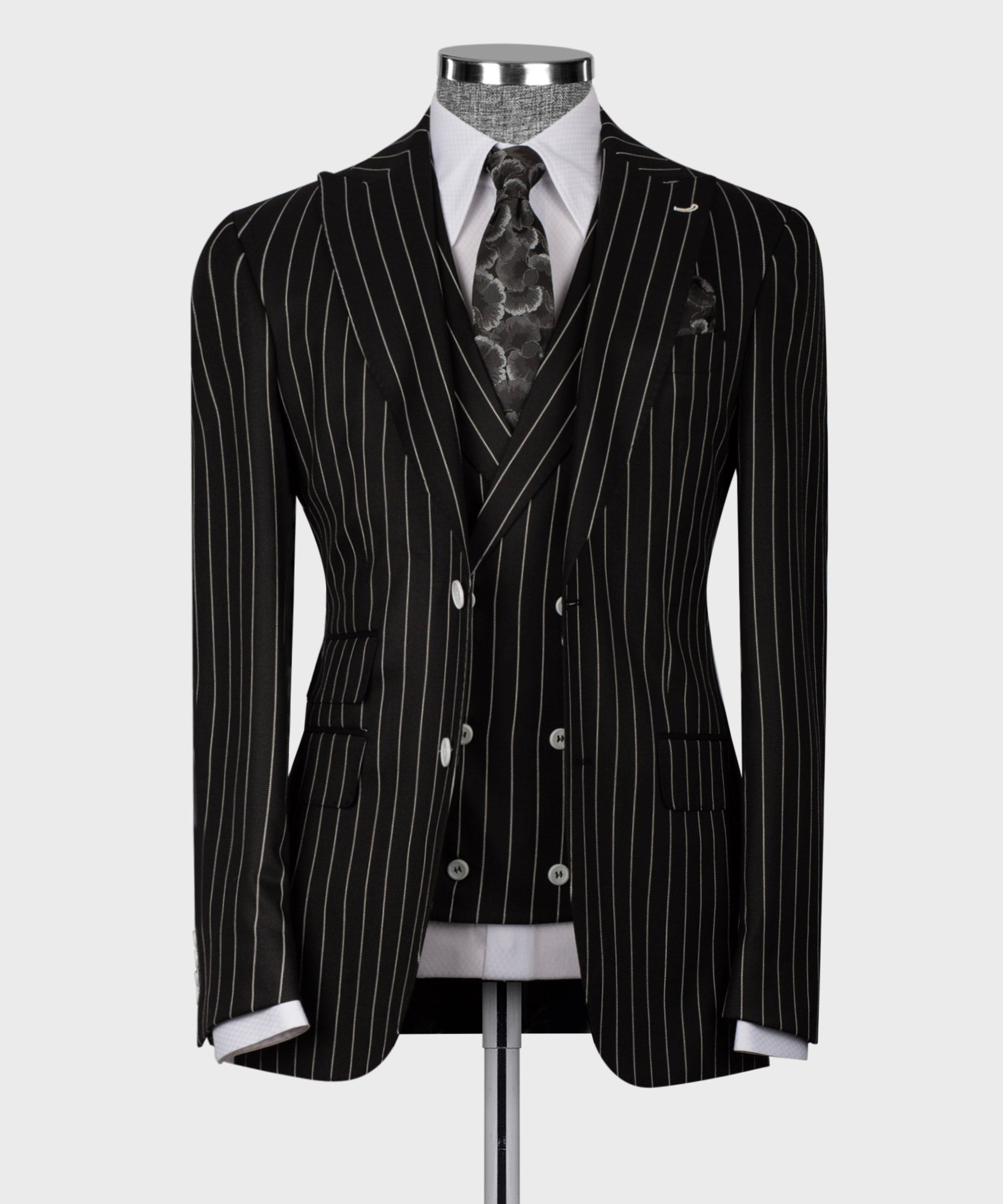 Black pinstriped suit jacket, double-breasted with white dress shirt and patterned tie