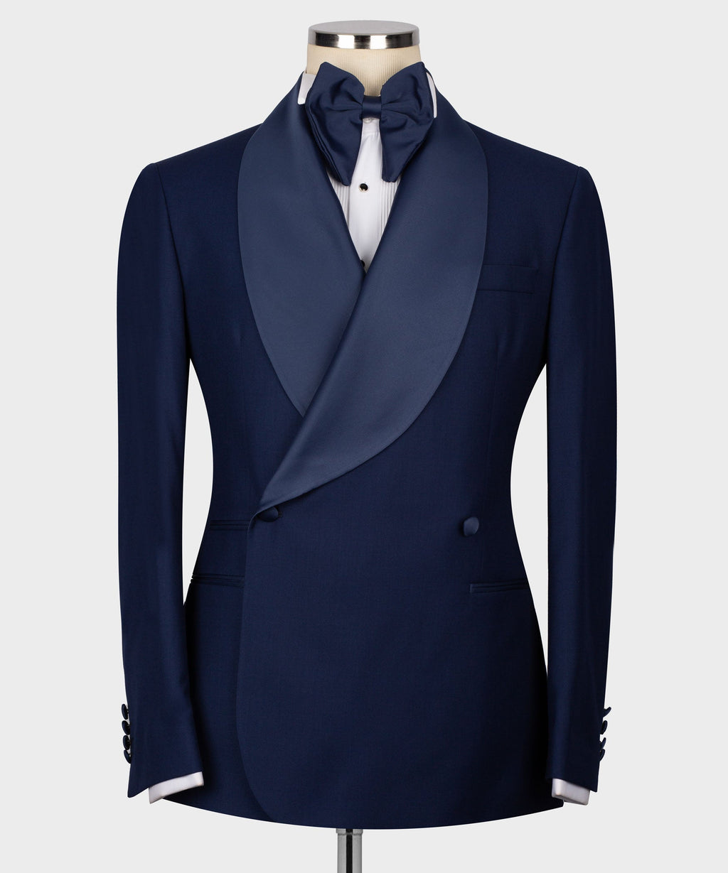 Navy tuxedo blazer with satin bow tie, vest front and white dress shirt