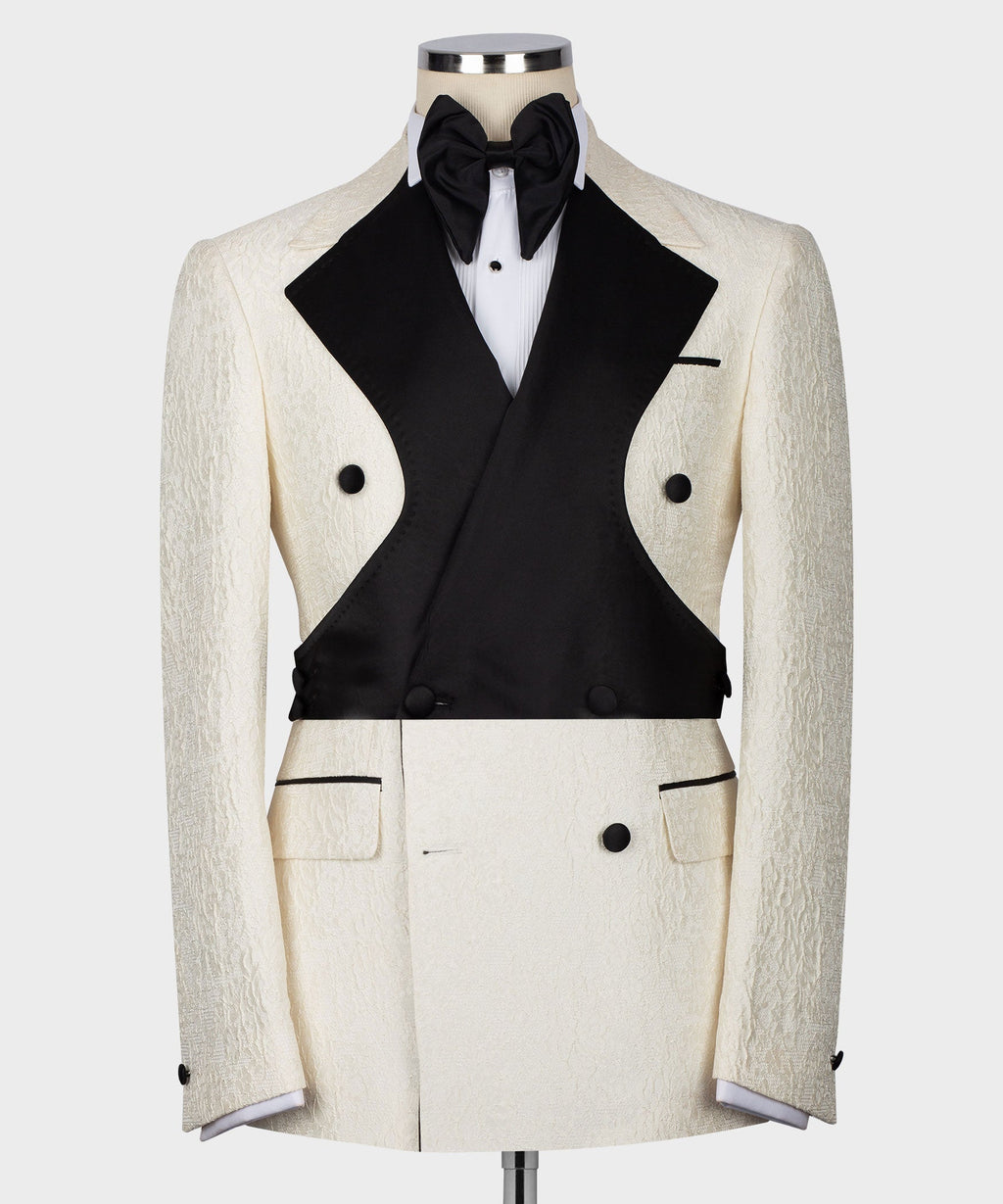 Cream textured tuxedo jacket with black satin vest, bow tie, and white shirt front