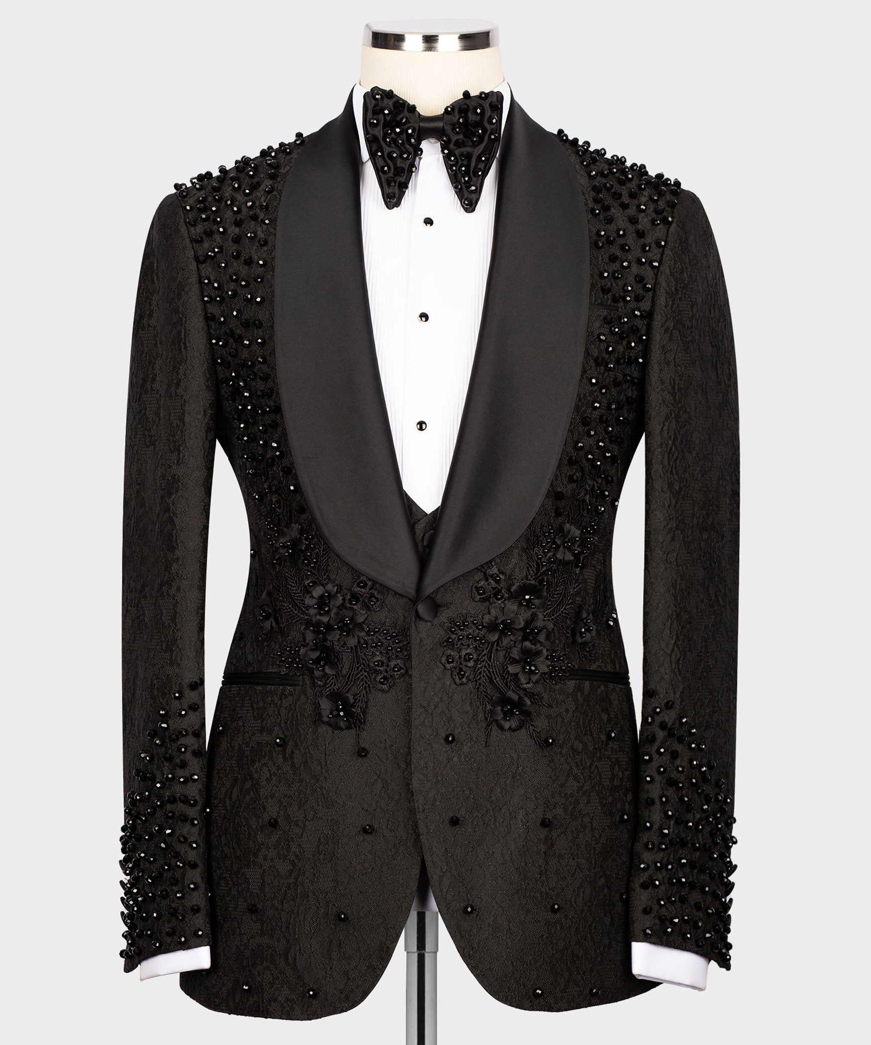 Black tuxedo blazer with satin lapels and bead embroidery on shoulders and chest