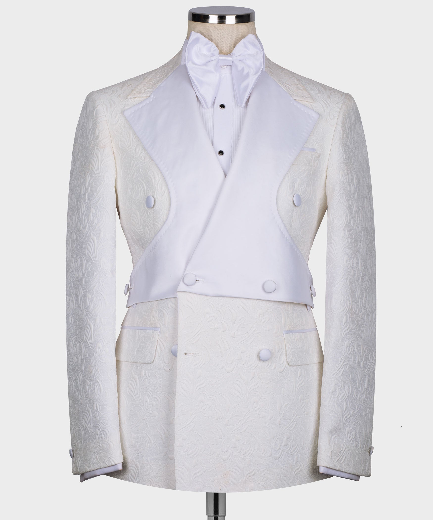 White double-breasted tuxedo jacket with bow neck shirt and matching trousers, front view