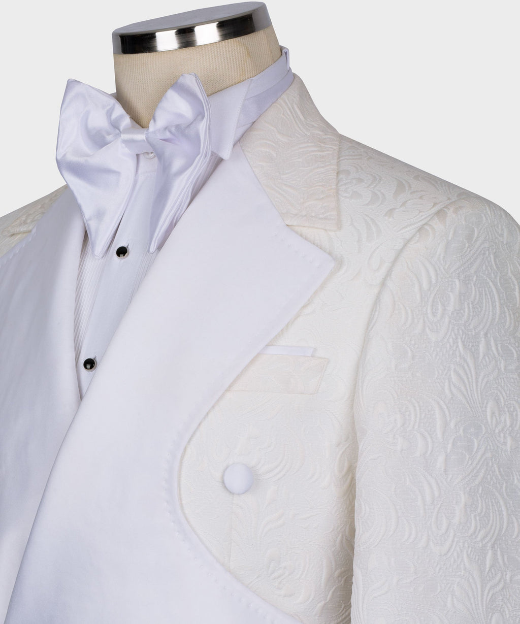 Close-up of white double-breasted tuxedo jacket with satin bow collar and lapels