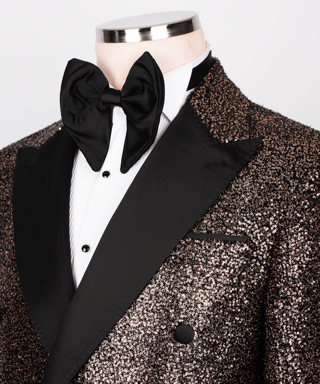 Close-up: black bow tie and satin-trim tuxedo shirt with copper sequin lapel