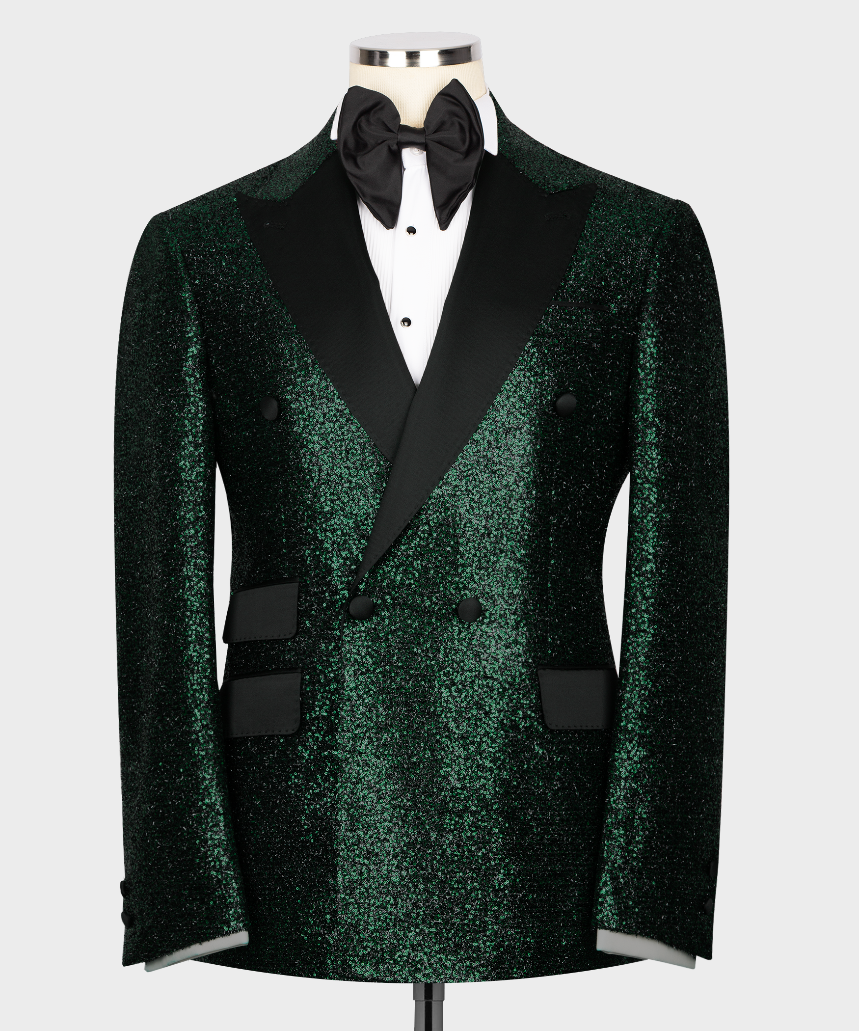 Green sequin tuxedo jacket with black lapels, bow tie, satin shirt front