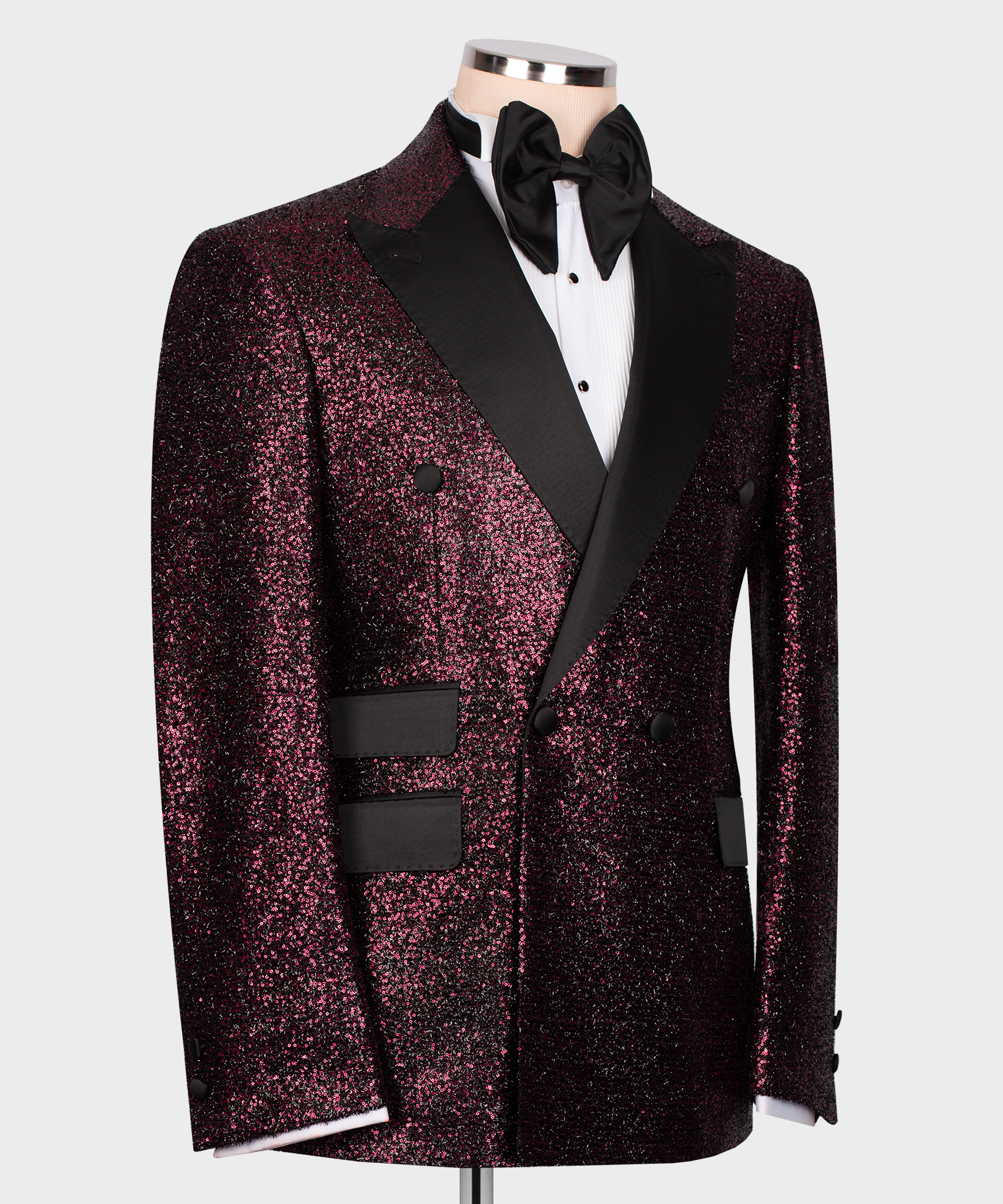 Men’s tuxedo jacket side view: dark pink sequin fabric, black vest panel, bow tie