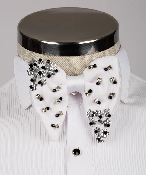 Koss Atelier white silk bow tie featuring black and silver crystal flower embellishments on a white pleated dress shirt.