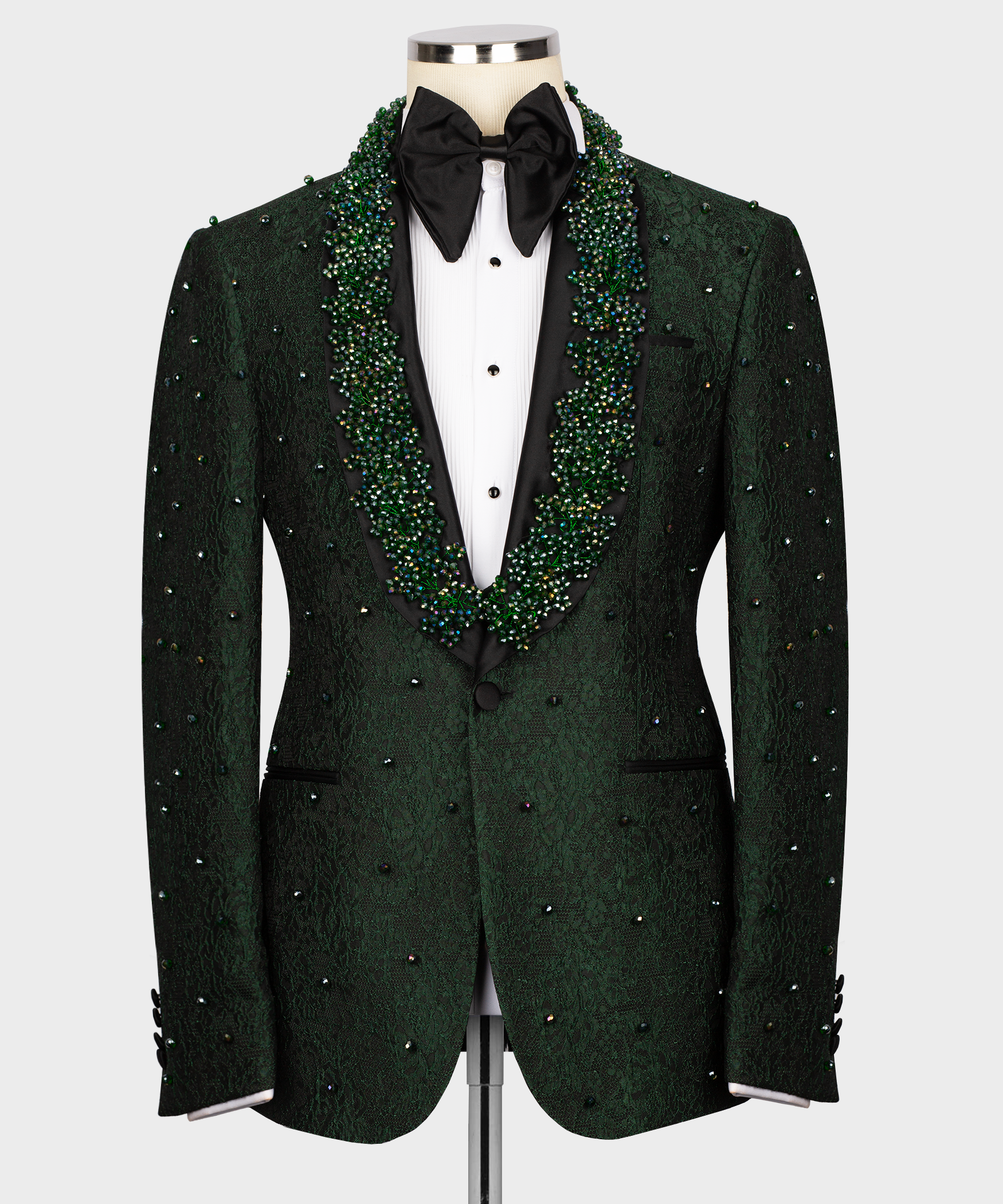Green embroidered tuxedo jacket with green-and-silver beaded trim and black bow tie