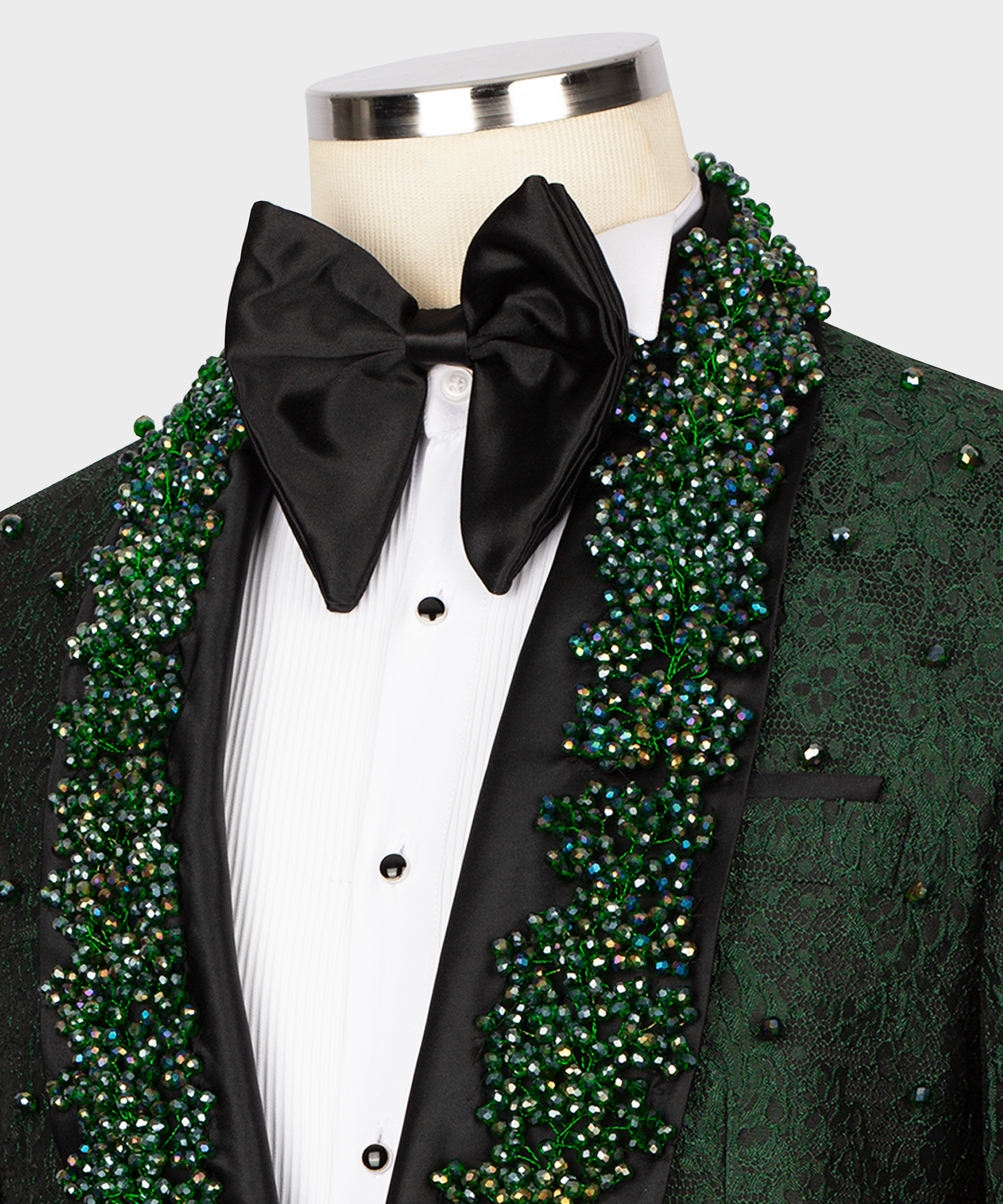 Black bow tie and white shirt front with green embroidered lapels and beaded trim