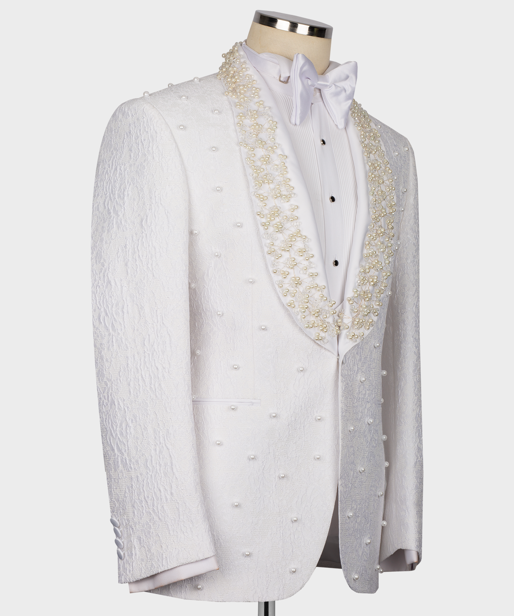 White tuxedo jacket with gold pearl-bead embroidery and satin bow tie detail