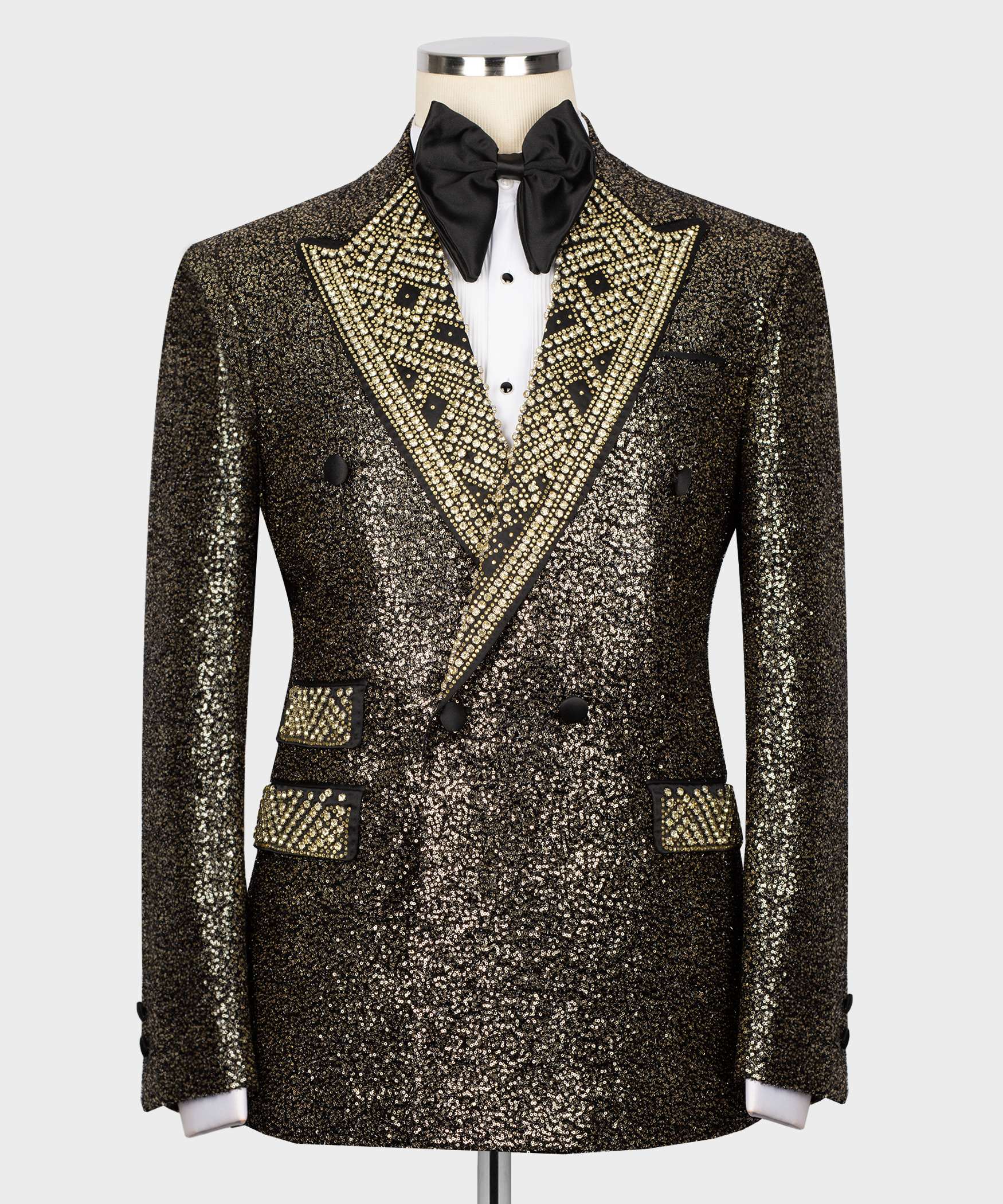 Gold sequin tuxedo jacket with jeweled trim, black bow tie, and white dress shirt