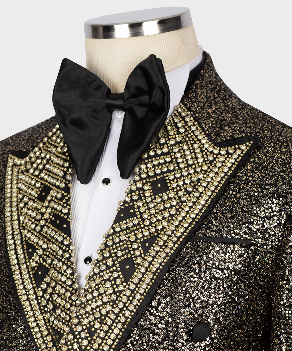 Detail of black bow tie and gold jeweled V-lapel on a sequin tuxedo jacket