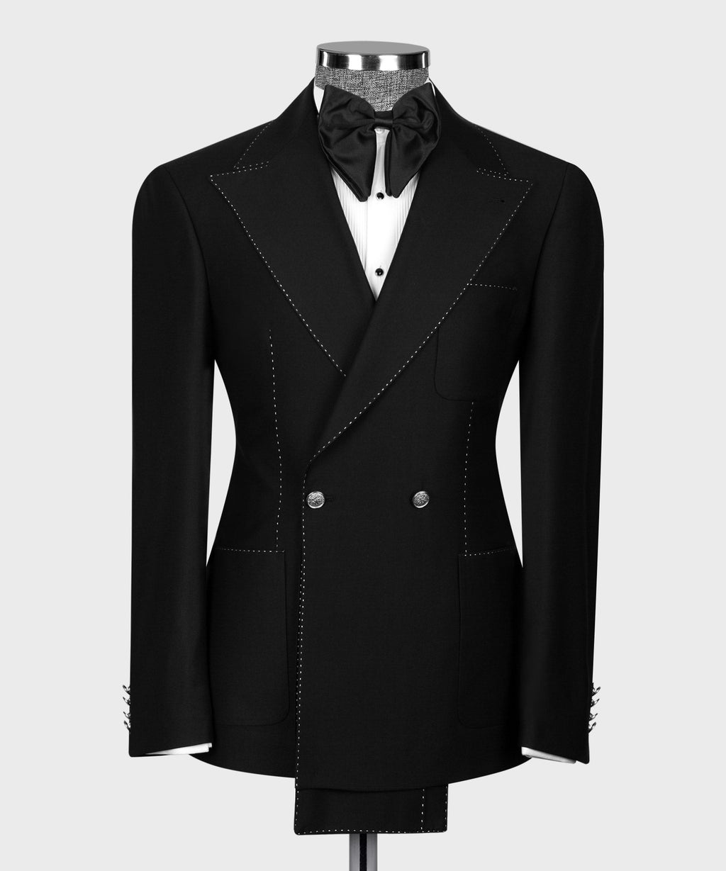 Black double-breasted tuxedo jacket with white spot-stitched detailing and satin bow tie