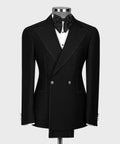 Black double-breasted tuxedo jacket with white spot-stitched detailing and satin bow tie