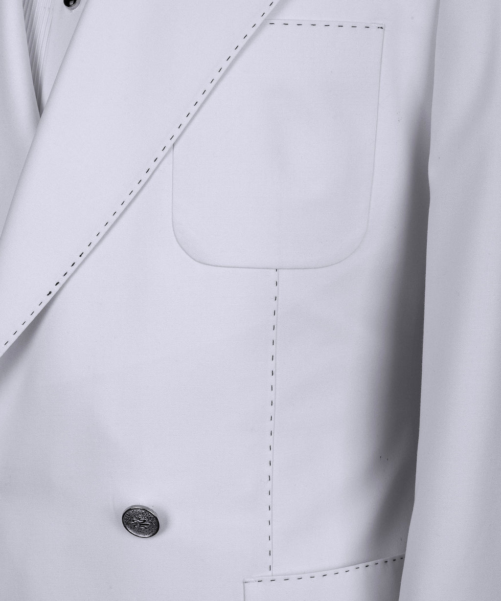 Close-up of white tuxedo jacket front pocket and double-breasted buttons
