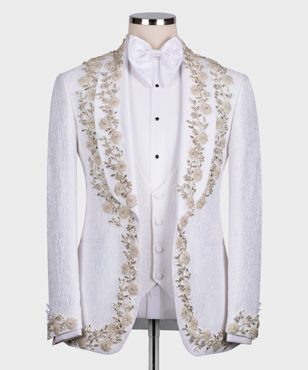 White tuxedo jacket with gold floral and stone embroidery, satin bow tie and vest front