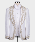 White tuxedo jacket with gold floral and stone embroidery, satin bow tie and vest front