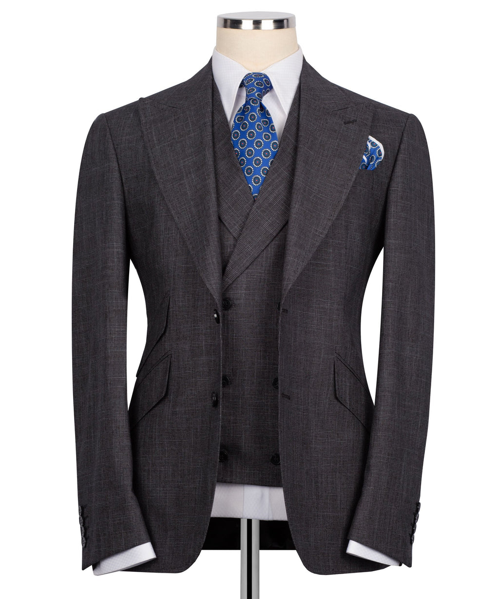 Plaid three-piece vest suit: dark jacket and vest with blue patterned tie and pocket square