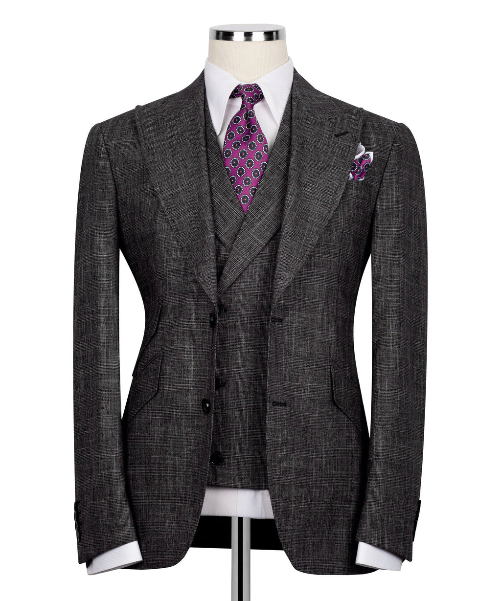 Black plaid men's suit jacket with notch lapels, purple patterned tie and pocket square