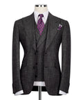 Black plaid men's suit jacket with notch lapels, purple patterned tie and pocket square