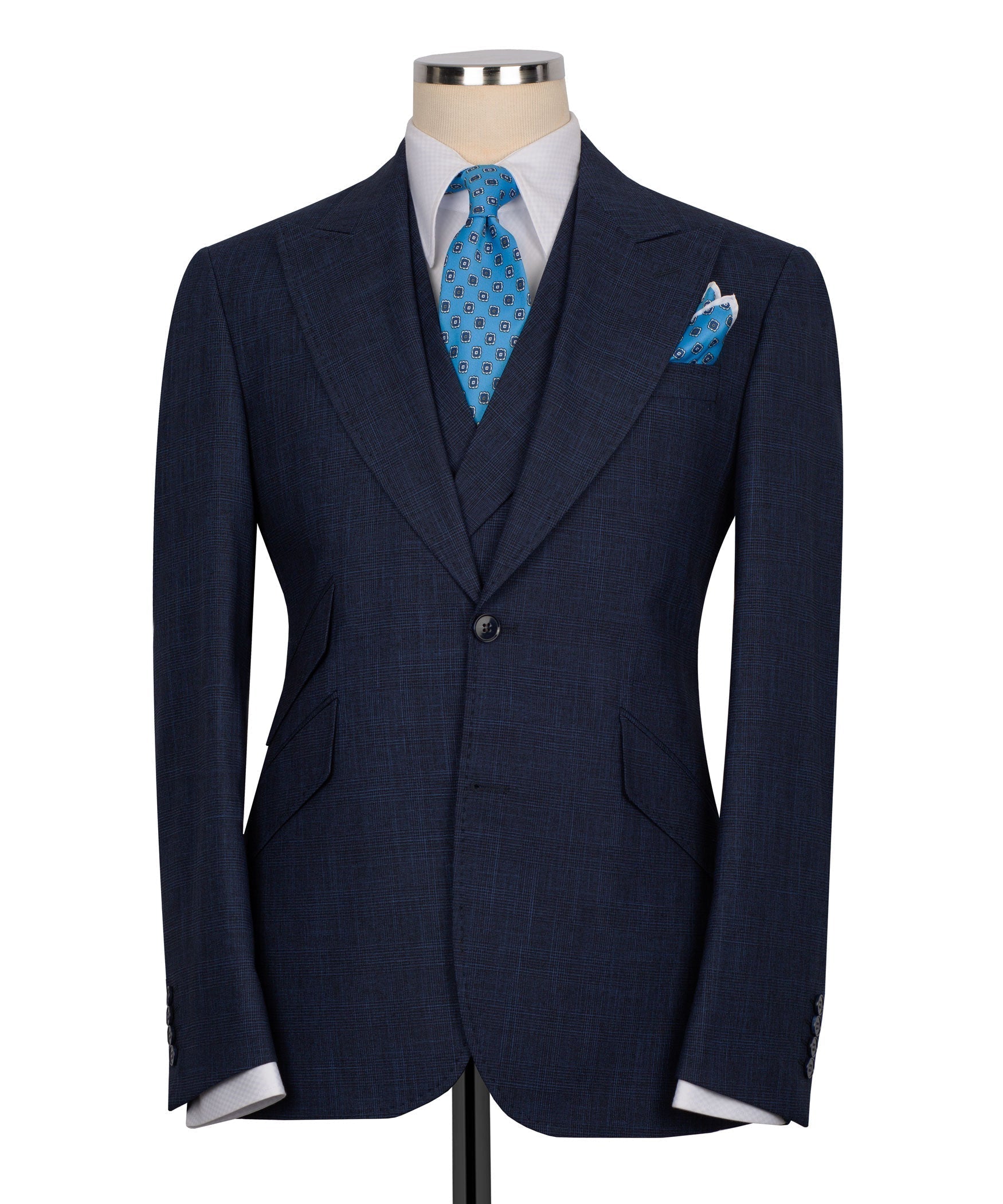 Dark navy men's three-piece vest suit with blue patterned tie and matching pocket square