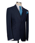 Dark navy three-piece suit jacket with blue patterned tie and pocket square, side view