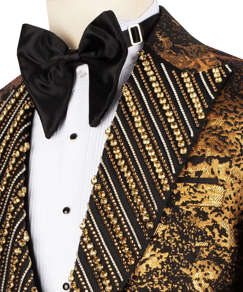 Close-up: gold beaded embroidery on black tuxedo lapel with black bow tie and white shirt
