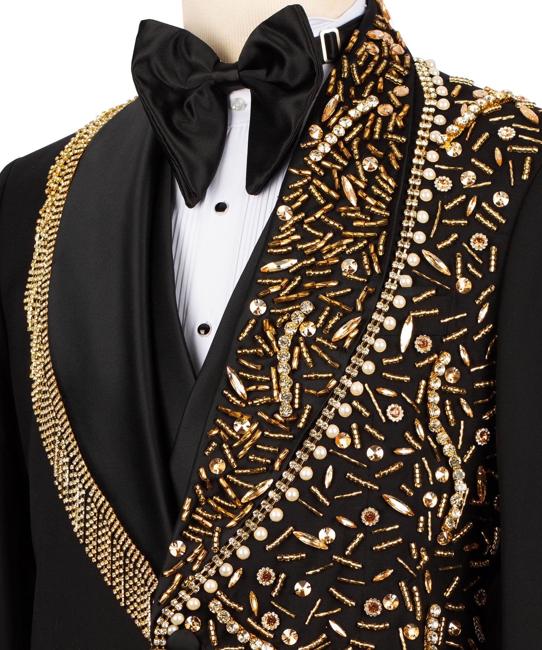 Close-up: black tuxedo bow tie with gold and pearl stone embroidery on vest