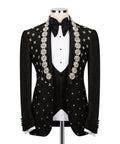 Black tuxedo jacket with floral-beaded embroidery, bow tie, and satin lapels over vest