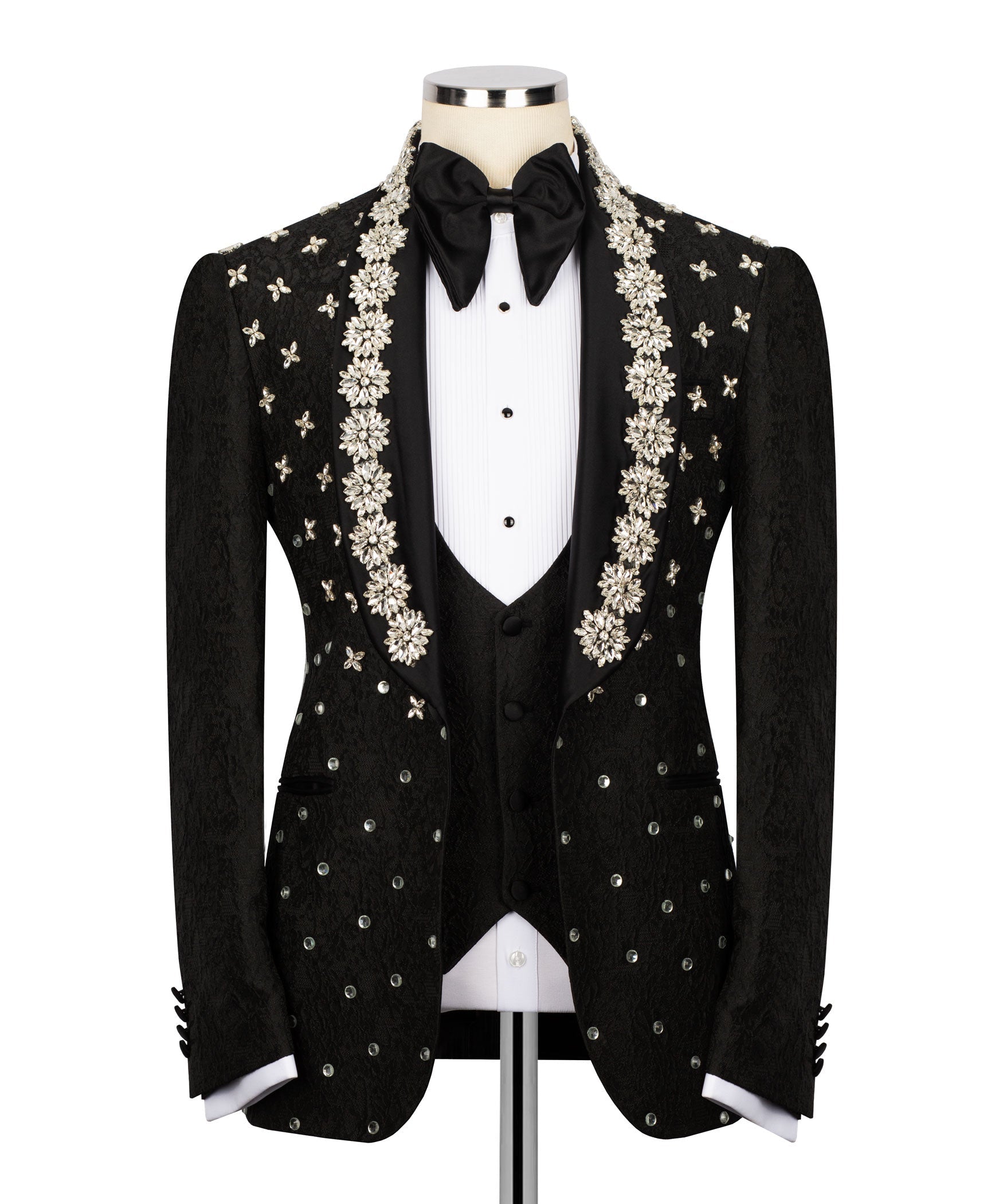 Black tuxedo jacket with floral-beaded embroidery, bow tie, and satin lapels over vest