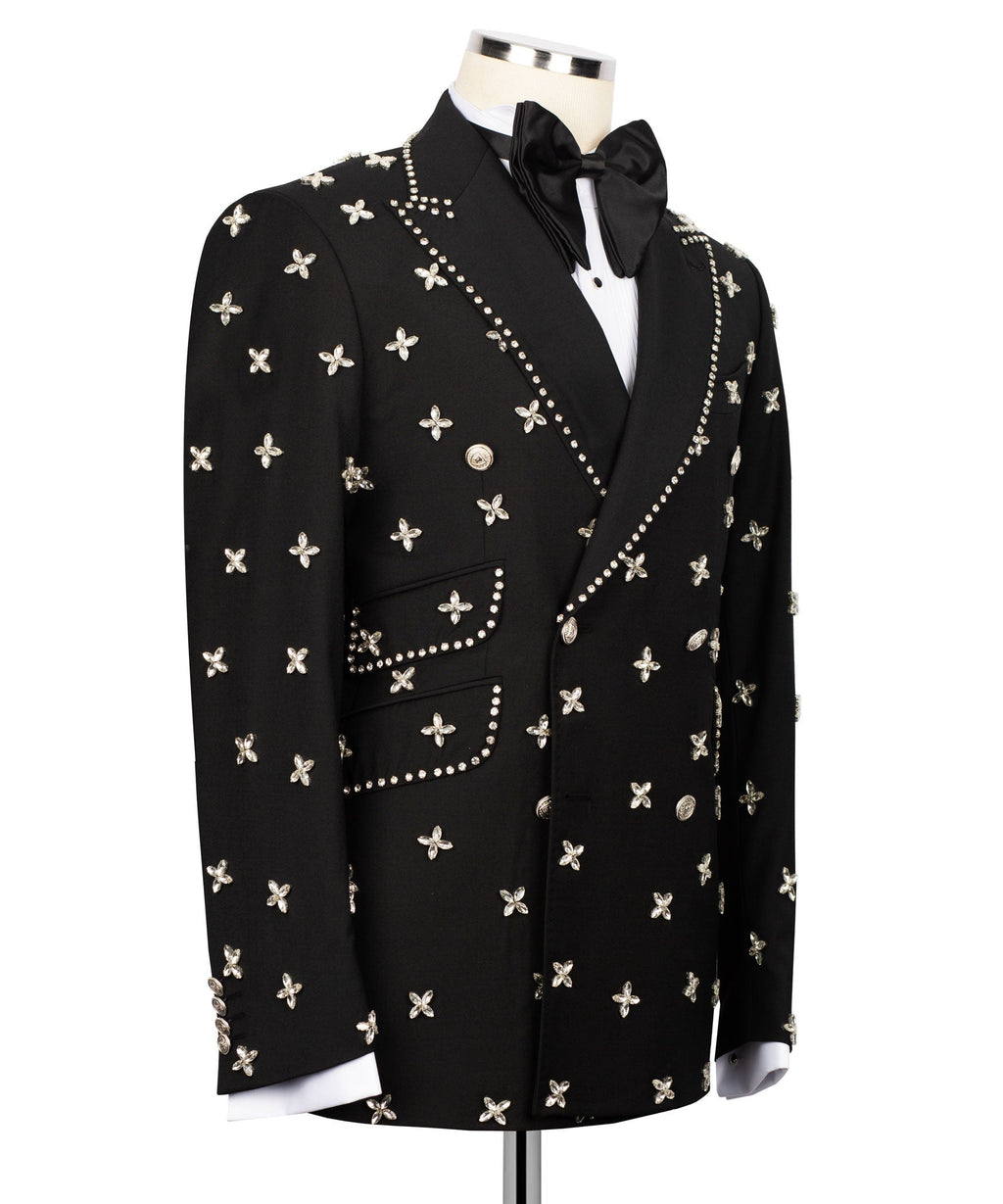 Black tuxedo jacket side view with studded trim and small butterfly motifs on sleeves