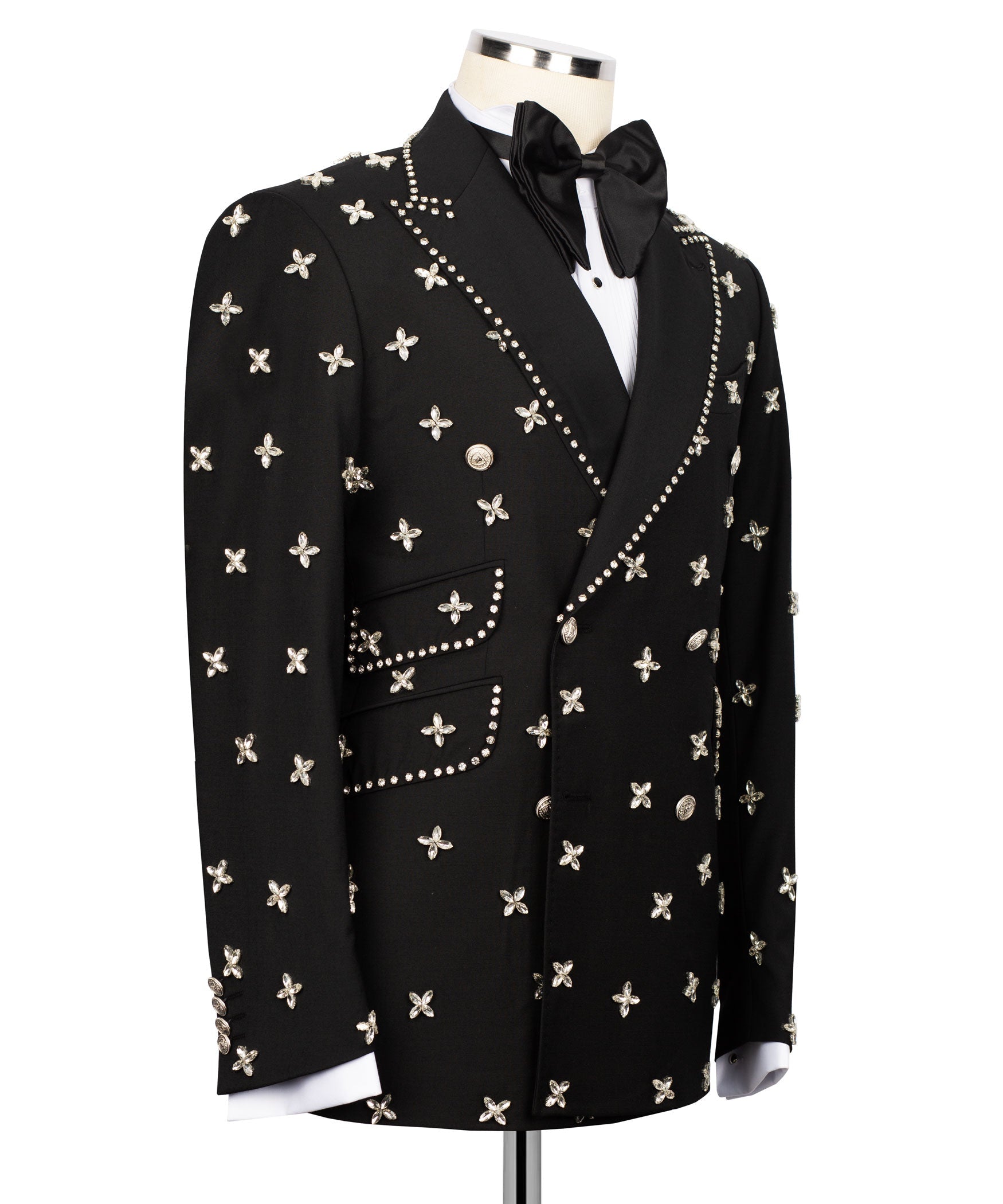 Black tuxedo jacket side view with studded trim and small butterfly motifs on sleeves