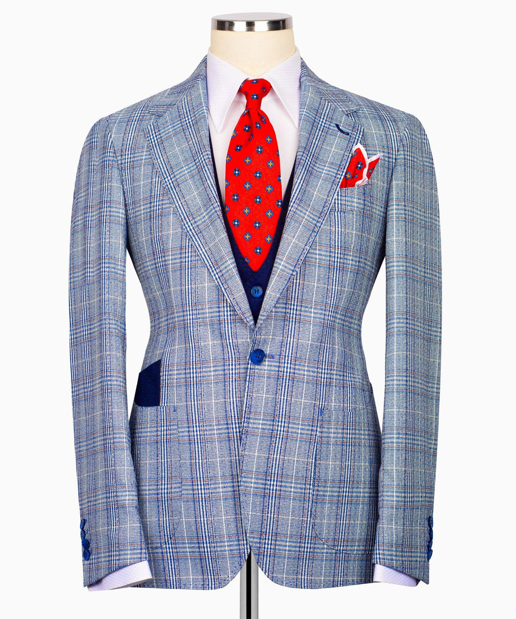 Light blue plaid three-piece suit jacket with red patterned tie and welt pockets