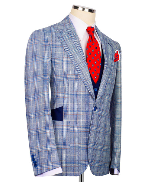 Light blue plaid sport coat with chest pocket, red patterned tie and pocket square