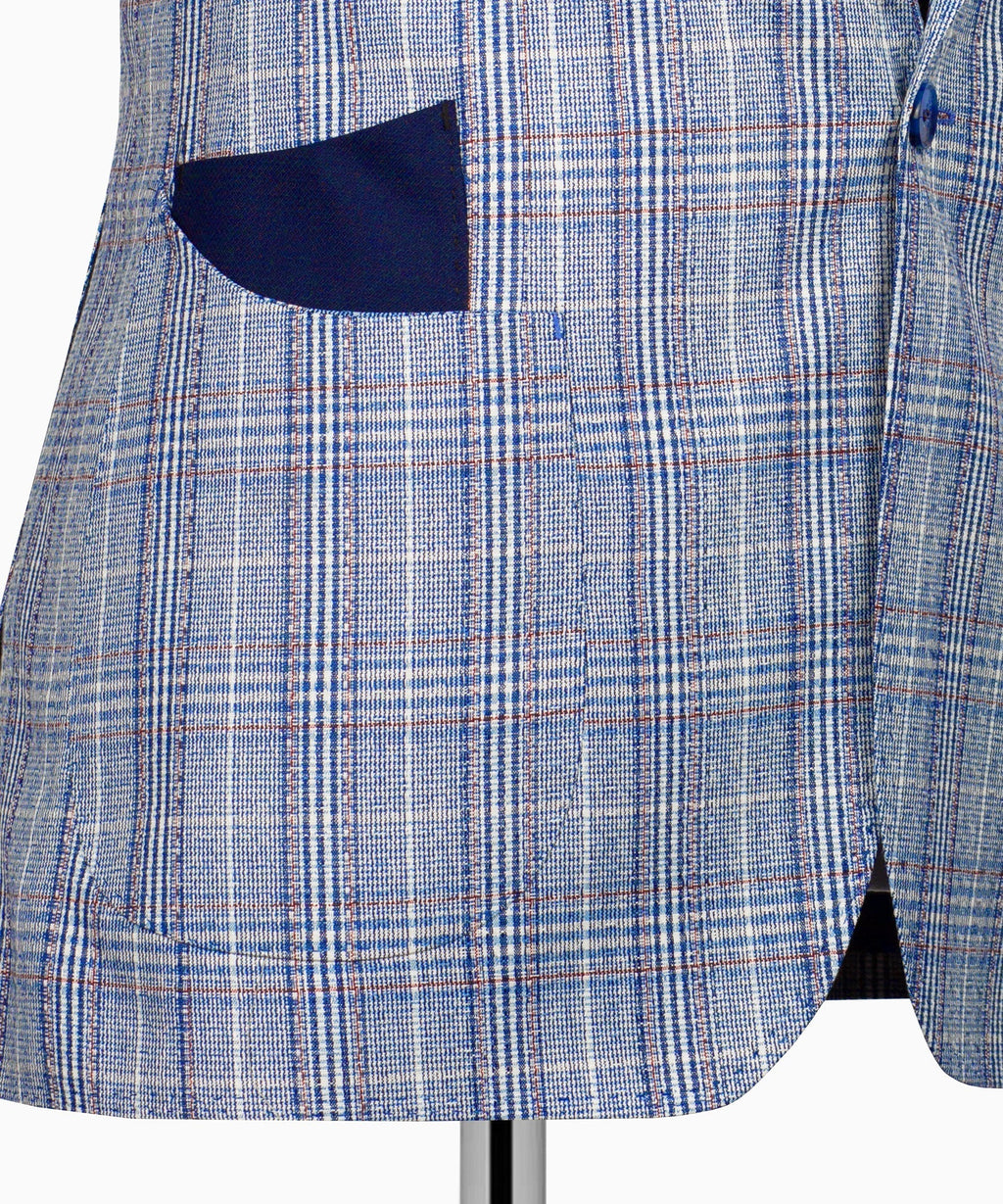 Light blue plaid blazer panel with dark inner pocket opening near hem