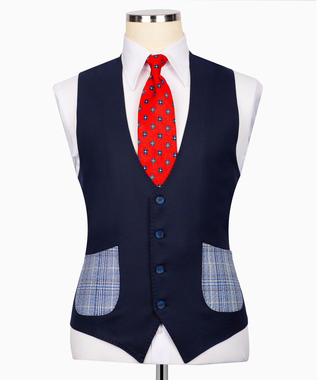 Navy vest with button front over light blue plaid suit, red tie and pocket square