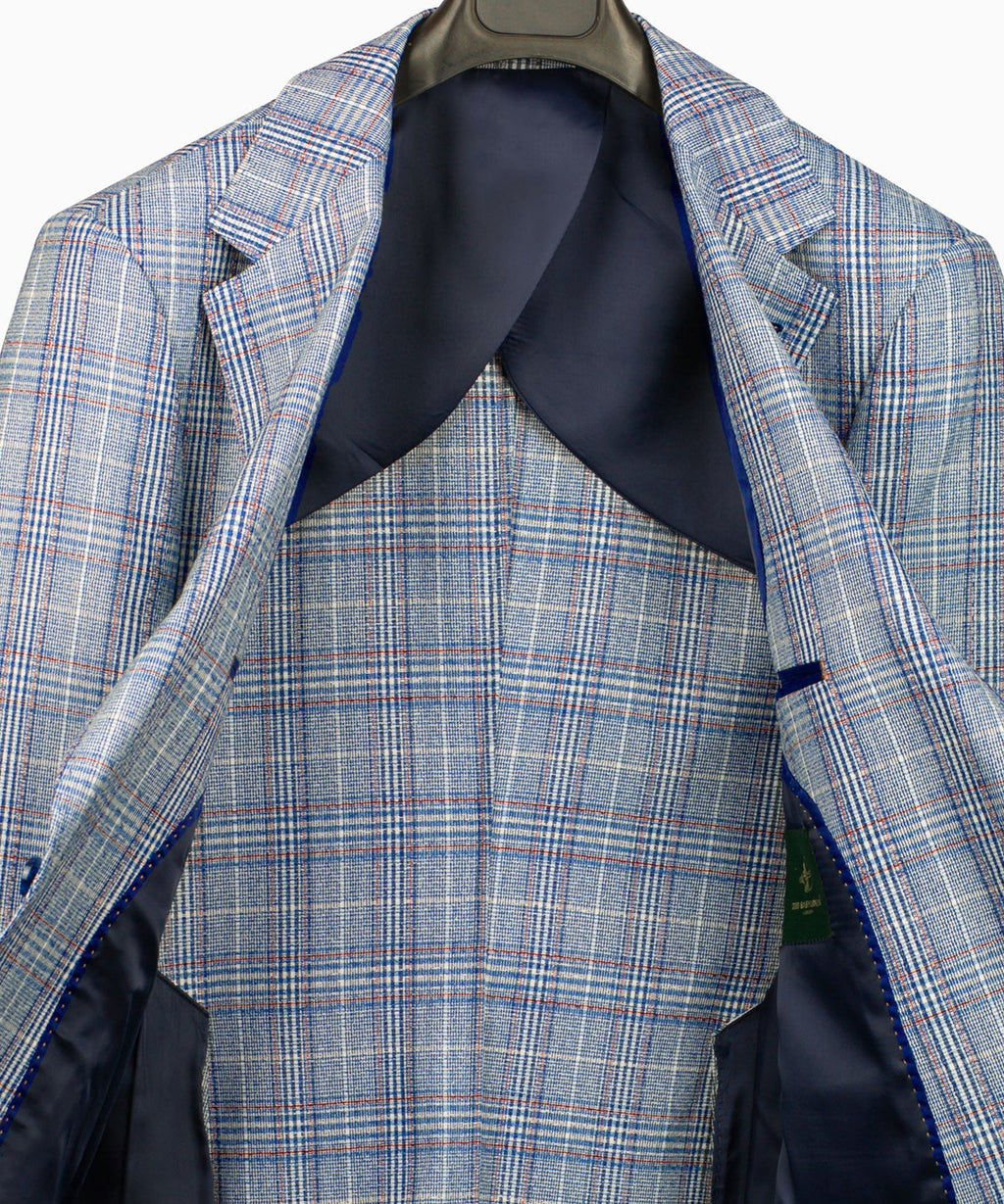 Light blue plaid suit jacket interior with dark lining and pocket flap