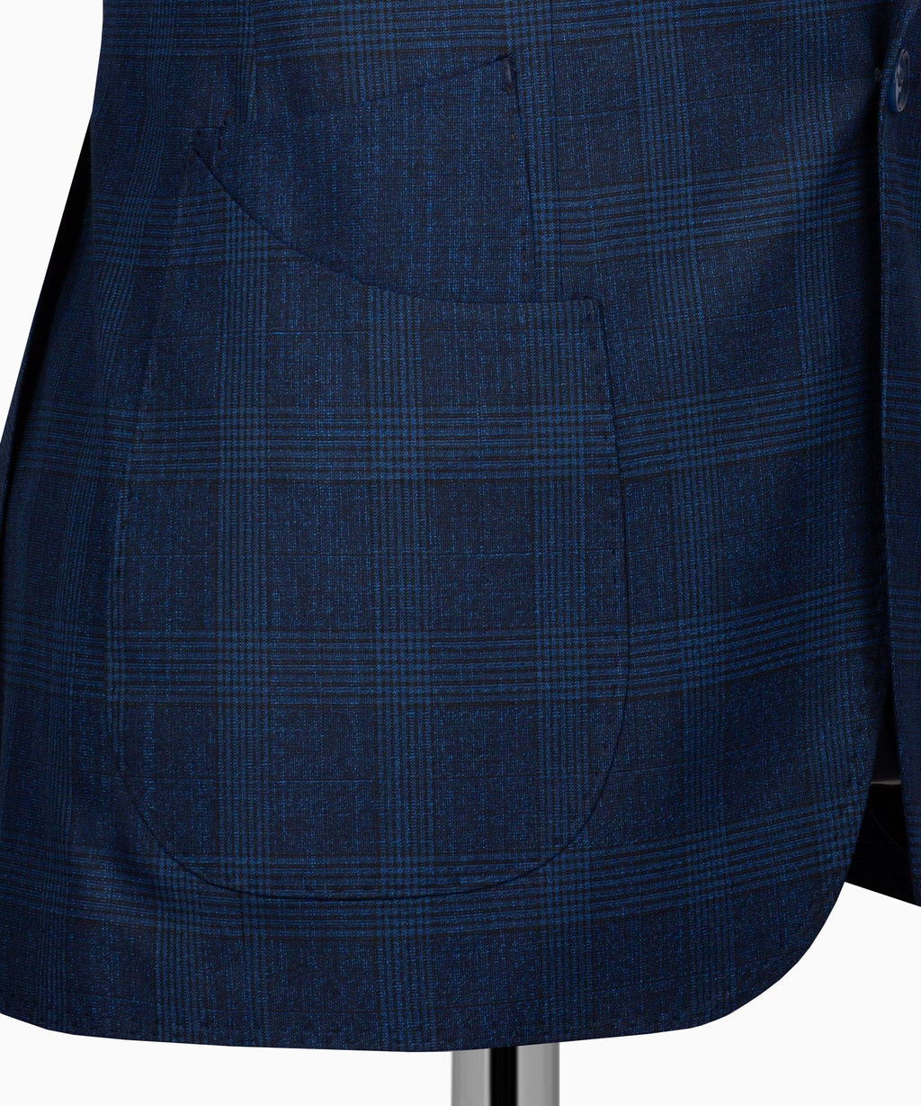 Navy plaid suit fabric detail with curved seam and buttoned area